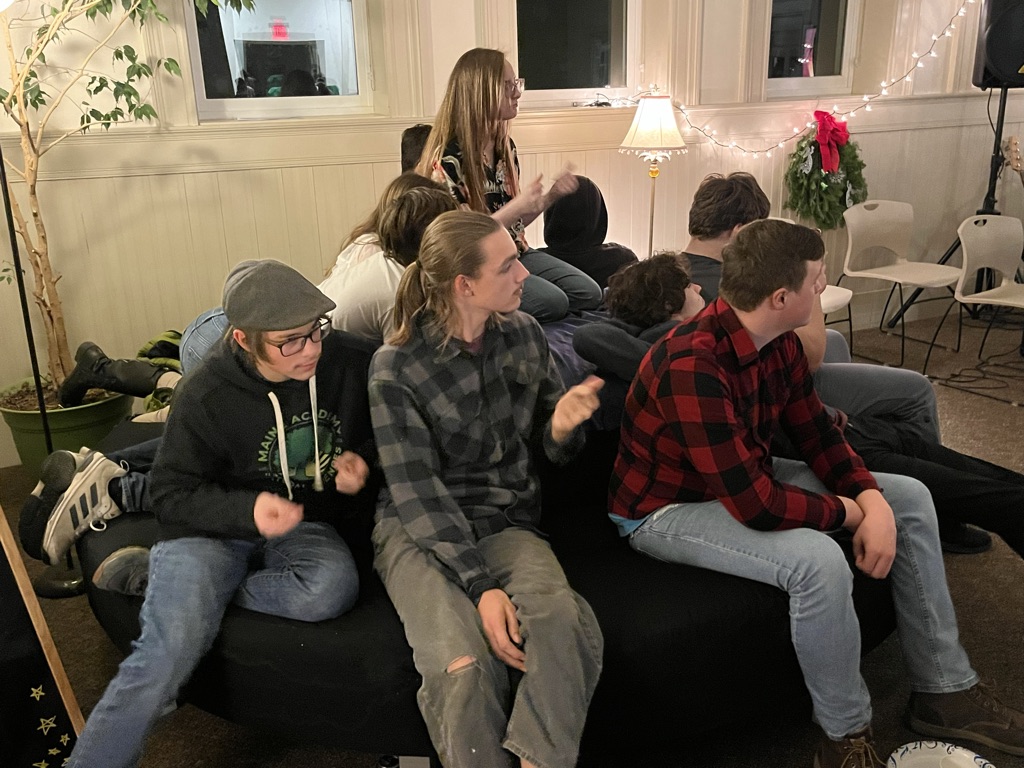 Maine high school students listen to music.
